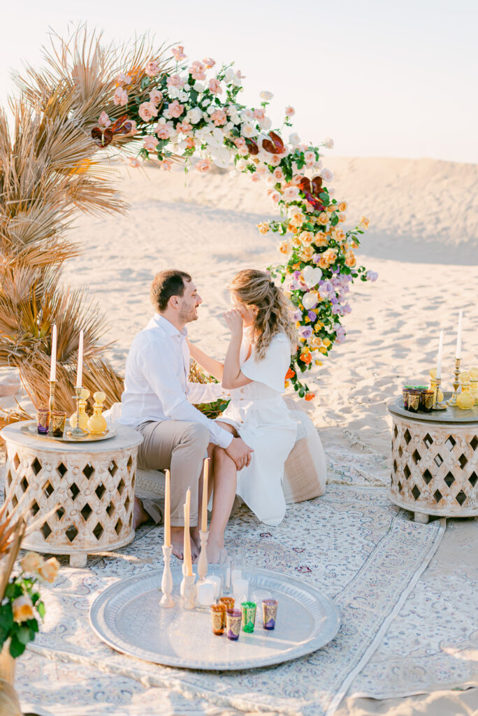 Romantic couple photoshoot in the Dubai desert at golden hour