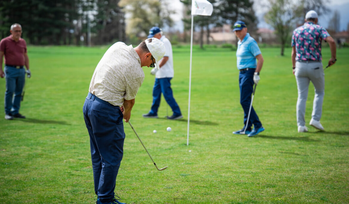 Golfer swinging club during professional golf tournament photography in Dubai – Zypix Sports Photographer